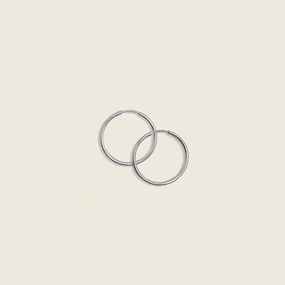 Live In Hoops – Sterling Silver: Lightweight, versatile hoop earrings crafted for everyday wear. Perfect for adding a touch of effortless elegance to any outfit with all-day comfort.