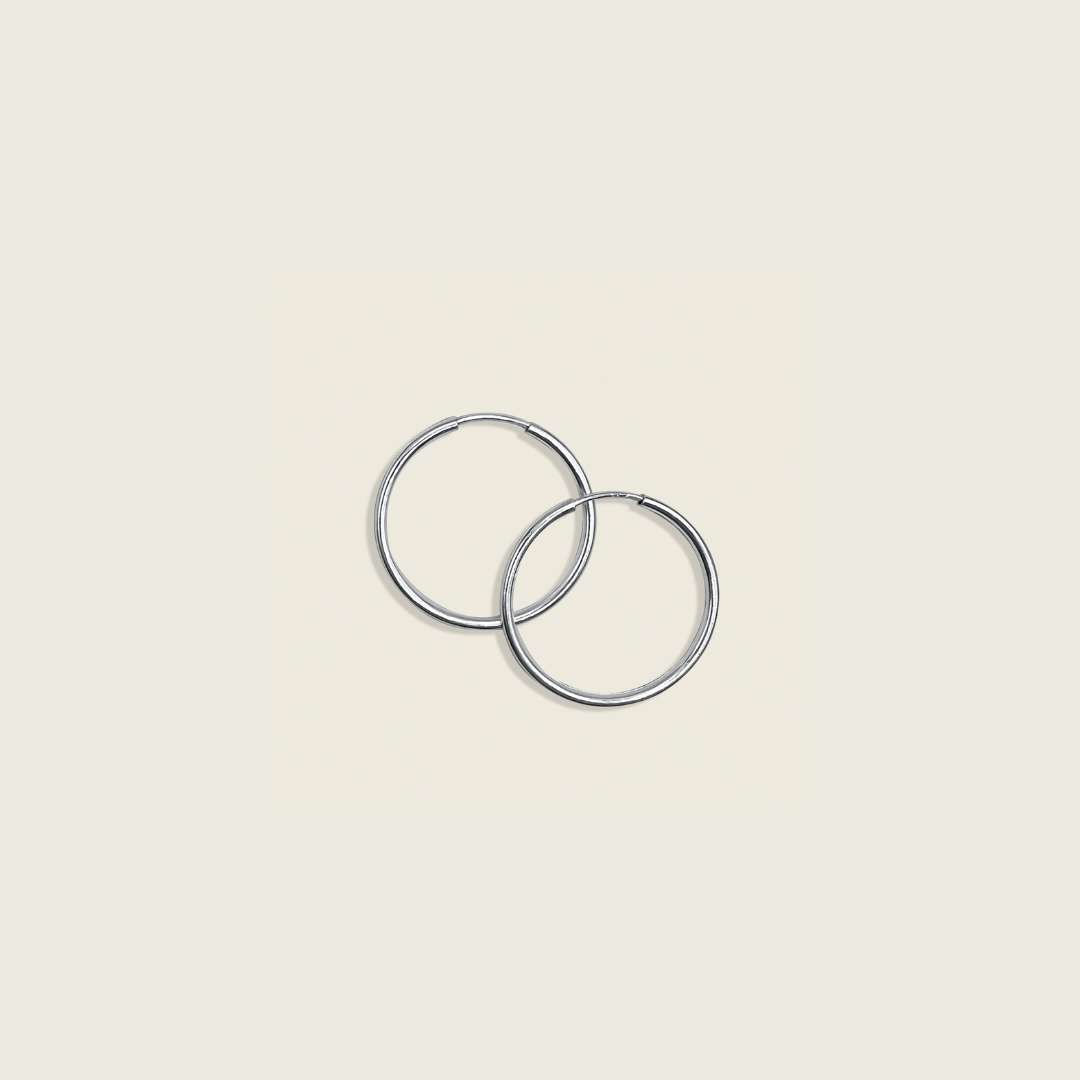 Live In Hoops – Sterling Silver: Lightweight, versatile hoop earrings crafted for everyday wear. Perfect for adding a touch of effortless elegance to any outfit with all-day comfort.