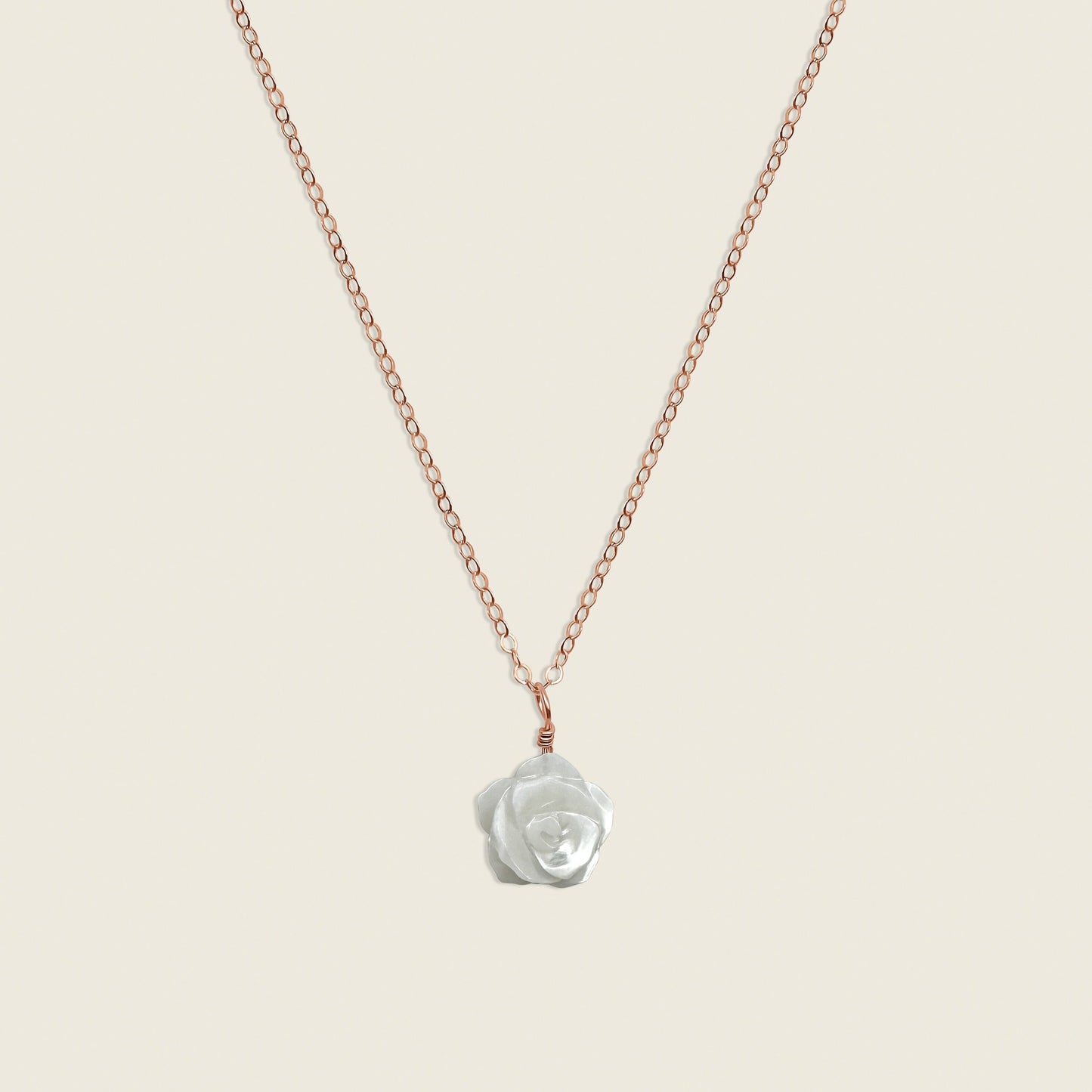 Mother of Pearl Rose Necklace in 14K Rose Gold Filled – a timeless and elegant accessory featuring a delicate mother of pearl rose charm. Perfect for adding a touch of sophistication and femininity to your style. Shop this handcrafted necklace today