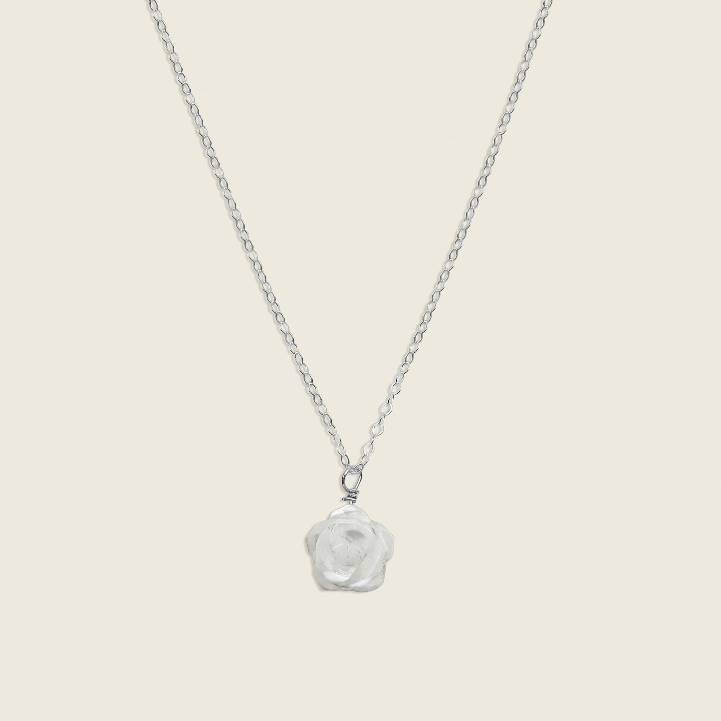 Mother of Pearl Rose Necklace in Sterling Silver – a timeless and elegant accessory featuring a delicate mother of pearl rose charm. Perfect for adding a touch of sophistication and femininity to your style. Shop this handcrafted necklace today