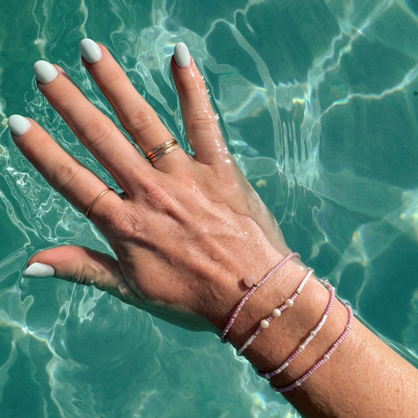Simple Stacking Ring in water – minimalist and water-resistant, crafted from durable, high-quality materials. Perfect for everyday wear, even in water. Shop versatile and long-lasting rings today!
