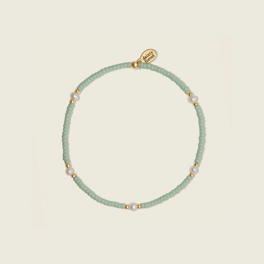 Soft Waves Bracelet crafted with seafoam green and 14k gold filled beads with freshwater pearls