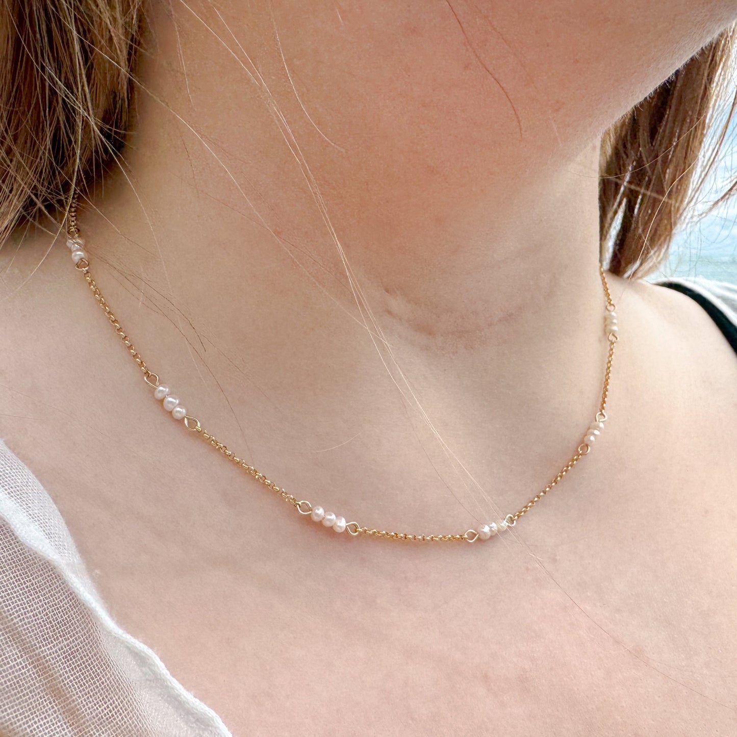 The Madelyn Necklace – a timeless accessory featuring freshwater pearls and 14K gold-filled accents. Perfect for adding a touch of elegance and sophistication to any look. Shop now for high-quality, handcrafted jewelry