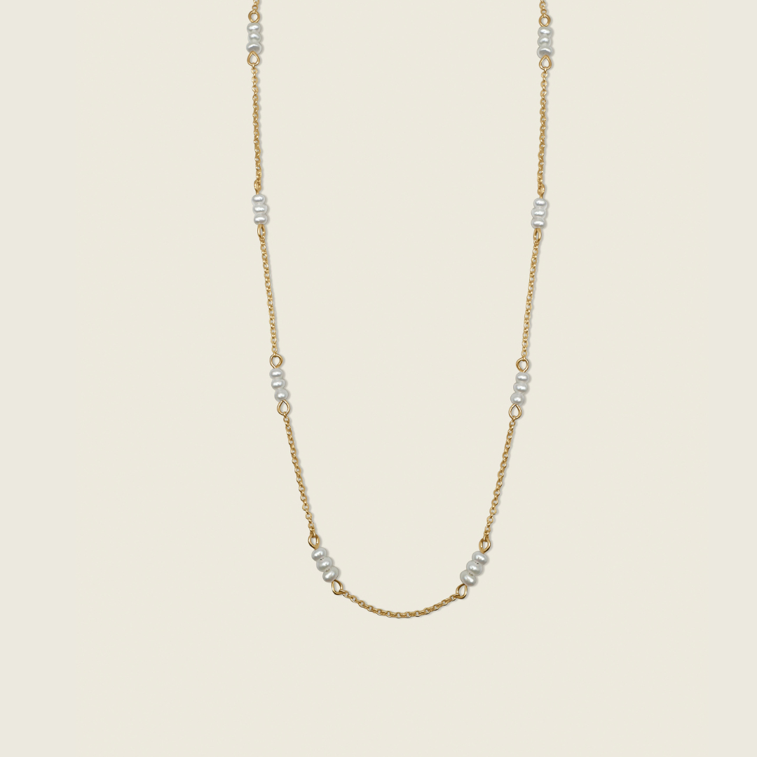 The Madelyn Necklace – a timeless accessory featuring freshwater pearls and 14K gold-filled accents. Perfect for adding a touch of elegance and sophistication to any look. Shop now for high-quality, handcrafted jewelry!