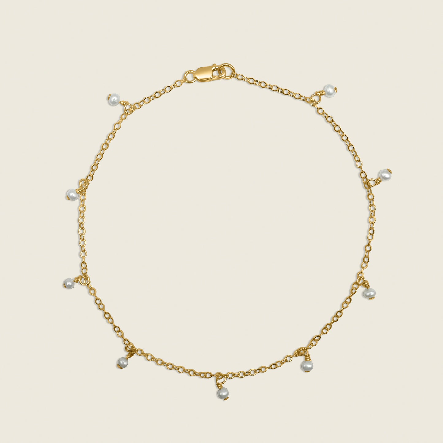 Timeless Pearl Ankle Bracelet – a delicate 14K gold-filled design featuring floating freshwater pearls. Perfect for adding a touch of elegance and sophistication to your everyday style. Shop now for timeless jewelry!
