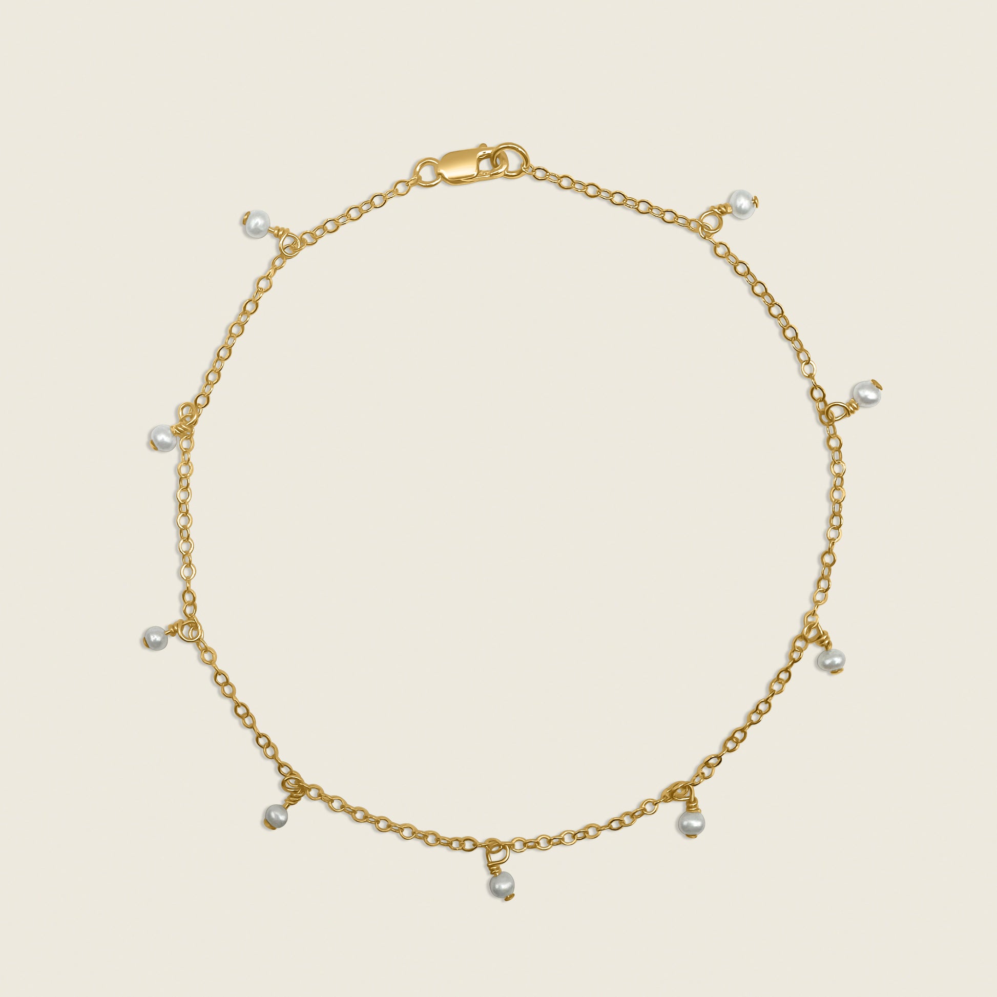 Timeless Pearl Ankle Bracelet – a delicate 14K gold-filled design featuring floating freshwater pearls. Perfect for adding a touch of elegance and sophistication to your everyday style. Shop now for timeless jewelry!