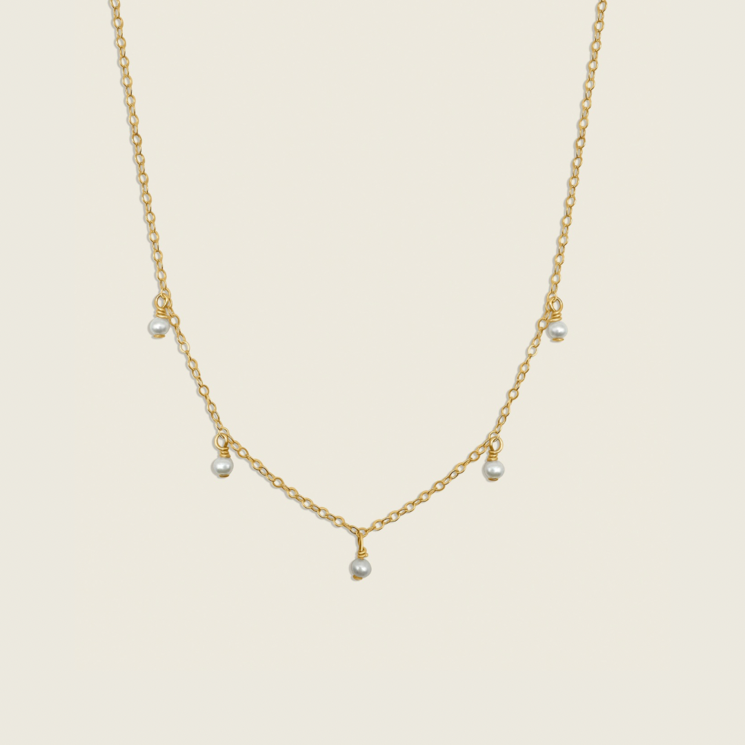 Timeless Pearl Necklace – handcrafted with genuine freshwater pearls and a 14K gold-filled chain. A classic, elegant accessory perfect for any occasion. Shop now for a timeless jewelry piece!