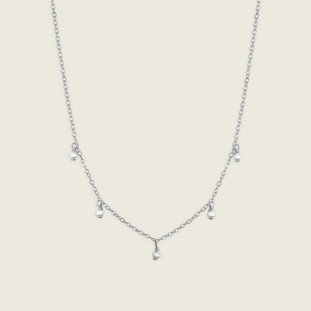 Timeless Pearl Necklace – handcrafted with genuine freshwater pearls and a Sterling Silver chain. A classic, elegant accessory perfect for any occasion. Shop now for a timeless jewelry piece!