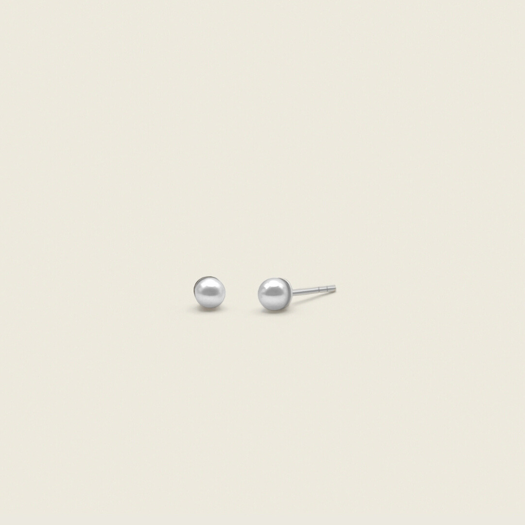 dainty pearl stud earrings in sterling silver with butterfly backings