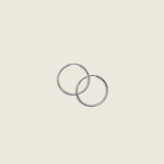 Live In Hoops – Sterling Silver: Lightweight, versatile hoop earrings crafted for everyday wear. Perfect for adding a touch of effortless elegance to any outfit with all-day comfort.
