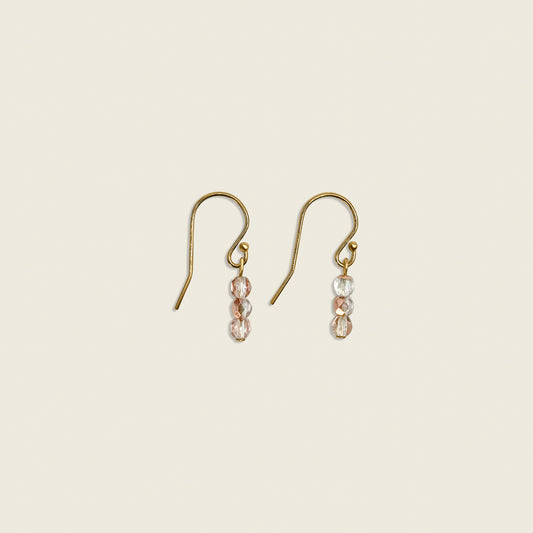 Blush Sands Earrings in 14K gold filled with rose gold Czech fire beads – a chic, elegant accessory that adds a sparkling touch to any outfit.