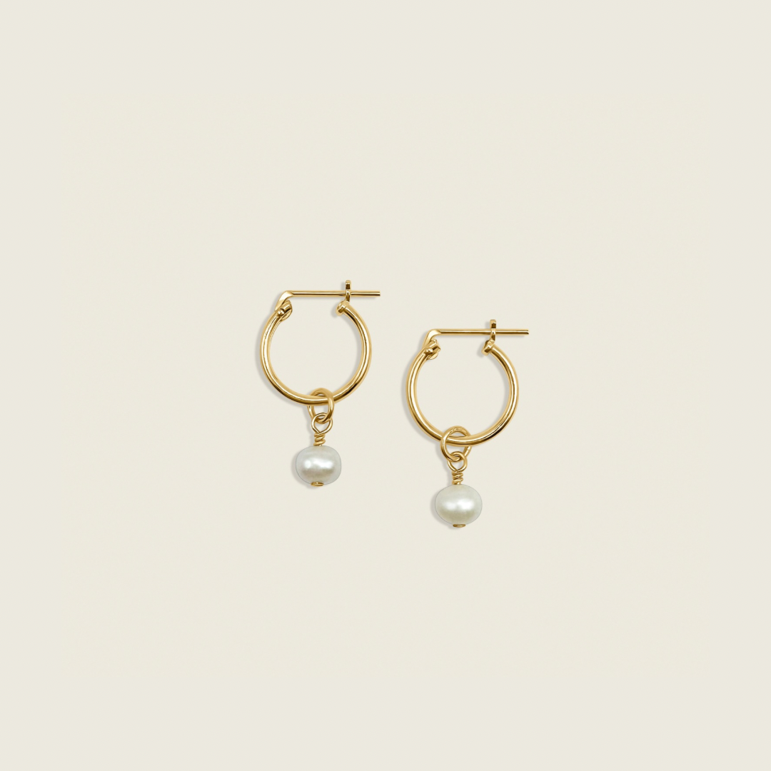 Pearl Charmed Earrings – versatile 2-in-1 hoops featuring elegant pearls, perfect for elevating your everyday style or adding a touch of sophistication to any outfit.