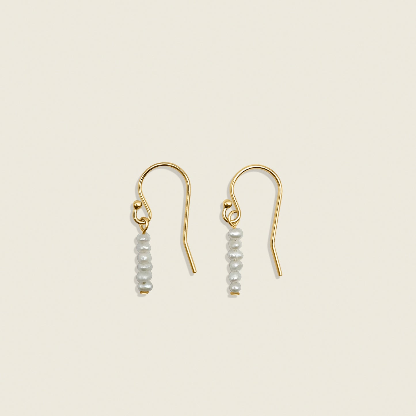 Pearl Stardust Earrings – dainty pearl drop earrings crafted with delicate seed pearls, perfect for adding a touch of elegance to any look. Shop these timeless accessories today!