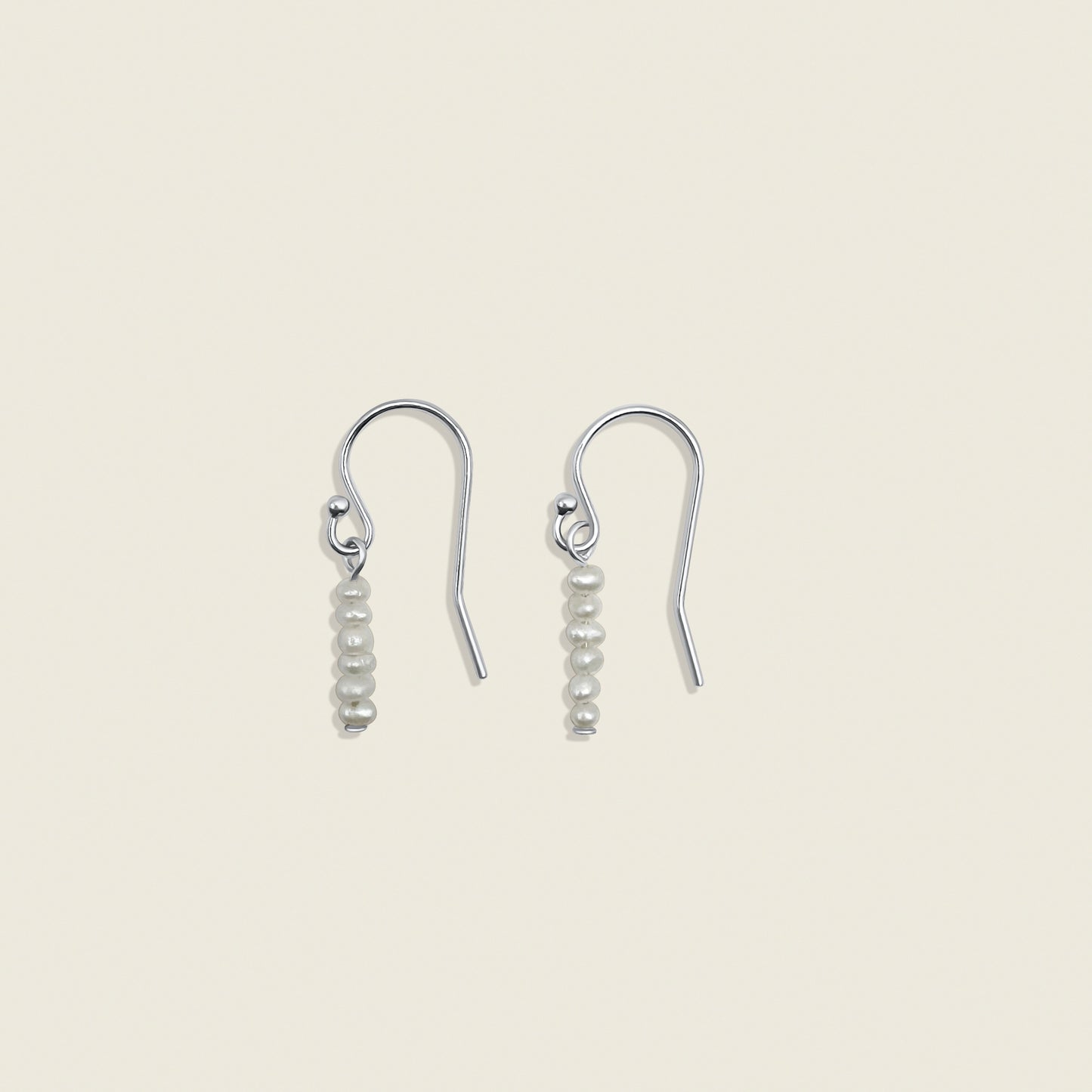 Pearl Stardust Earrings – dainty pearl drop earrings crafted with delicate seed pearls, perfect for adding a touch of elegance to any look. Shop these timeless accessories today!