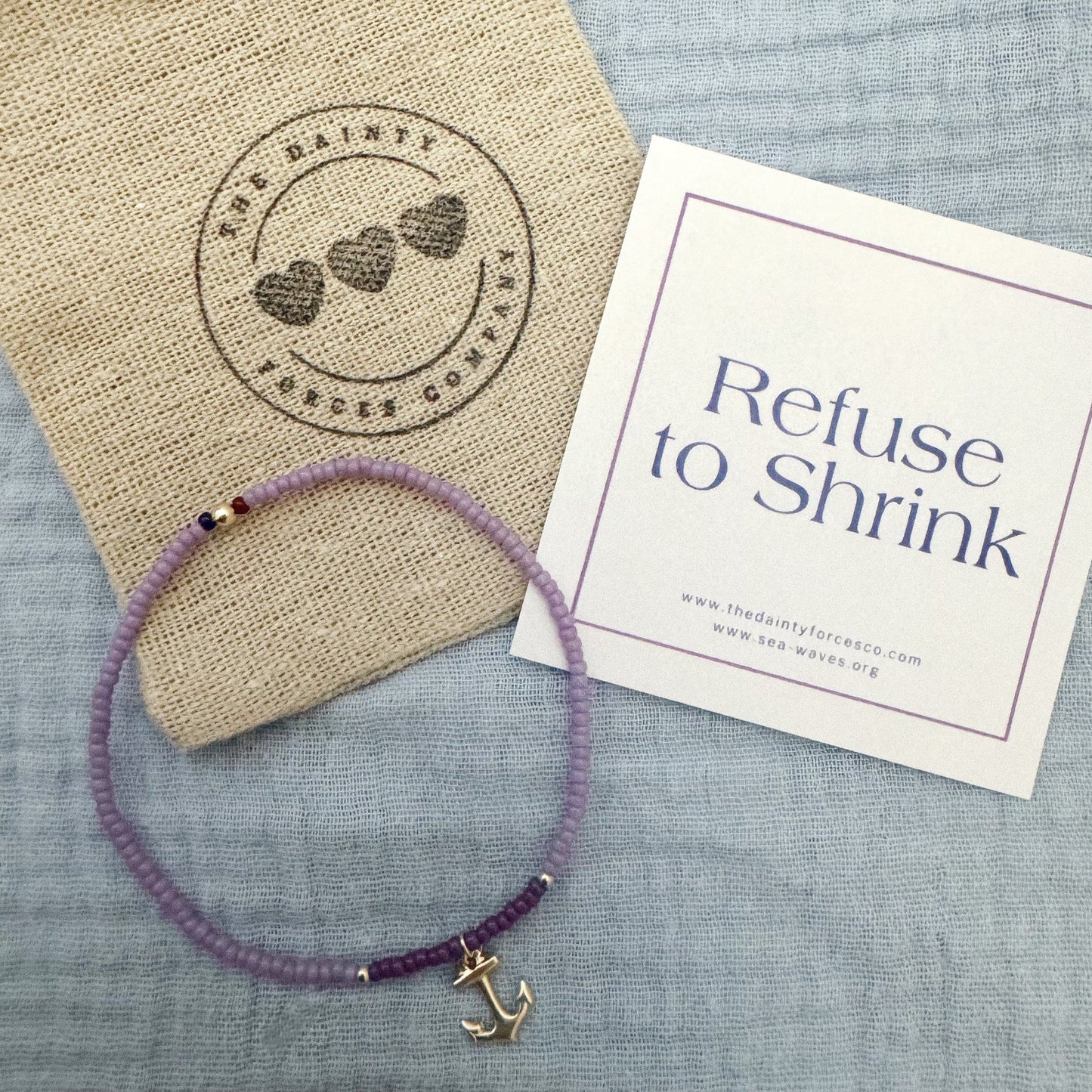 refuse to shrink bracelet collaboration with sea waves non profit organization - light and dark purple bracelet with gold filled beads and a gold filled anchor