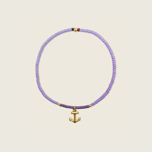 refuse to shrink bracelet collaboration with sea waves non profit organization - light and dark purple bracelet with gold filled beads and a gold filled anchor