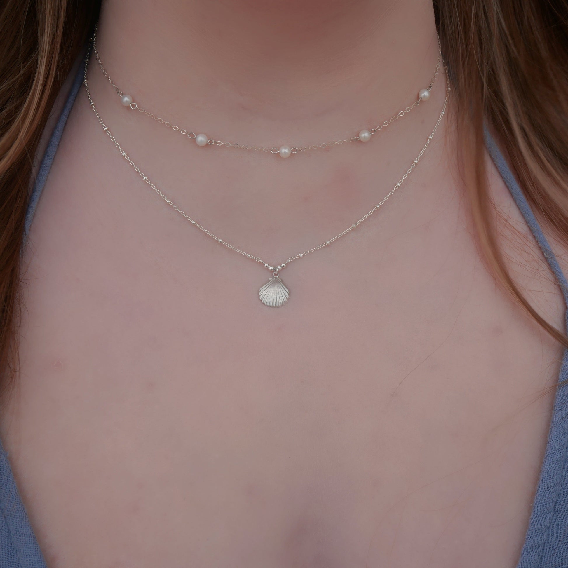 Seaside Necklace in Sterling Silver – a minimalist stacking necklace inspired by coastal charm, perfect for layering or wearing alone. Shop timeless, high-quality sterling silver jewelry today