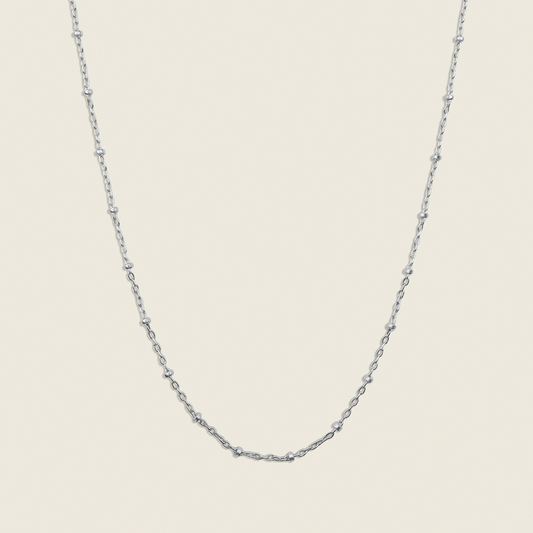 Stars in the Sky Satellite Chain Necklace – a dainty and elegant accessory featuring delicate gold-filled beads on a satellite chain. Perfect for layering or wearing alone to add a subtle celestial sparkle to any look. Shop now for timeless style!