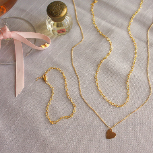 14K Gold Filled heartstring necklace and matching bracelet, with the heart charmed necklace, and heart stud earrings made for everyday wear and perfect for valentines day. 