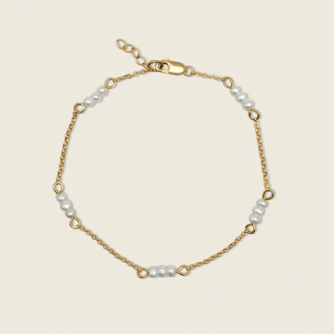 The Madelyn Bracelet – a timeless accessory featuring freshwater pearls and 14K gold-filled accents. Perfect for adding a touch of elegance and sophistication to any look. Shop now for high-quality, handcrafted jewelry!