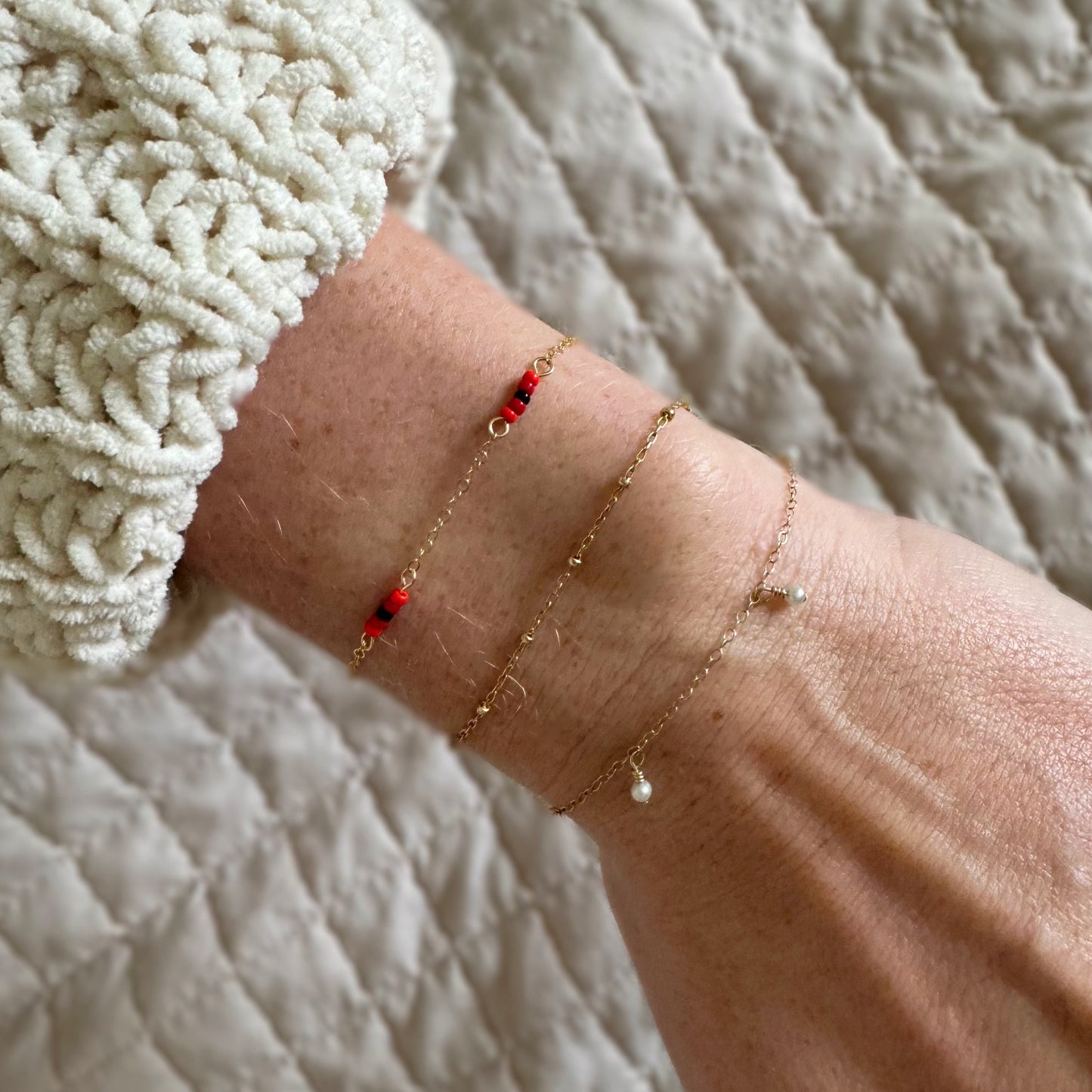 The Poppy Bracelet Stack – featuring the timeless pearl bracelet and the Stars in the Sky bracelet. A stunning combination of elegance and celestial charm, perfect for elevating any look. Shop this versatile and stylish bracelet stack today