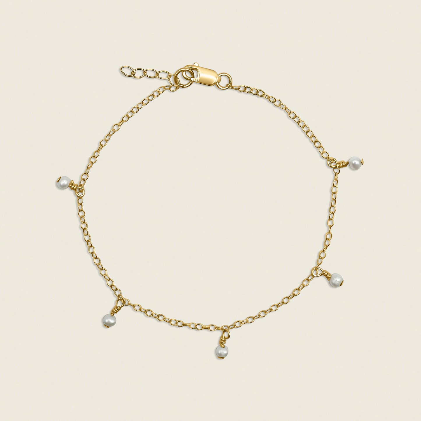 Timeless Pearl Bracelet – a delicate 14K gold-filled design featuring floating freshwater pearls. Perfect for adding a touch of elegance and sophistication to your everyday style. Shop now for timeless jewelry!