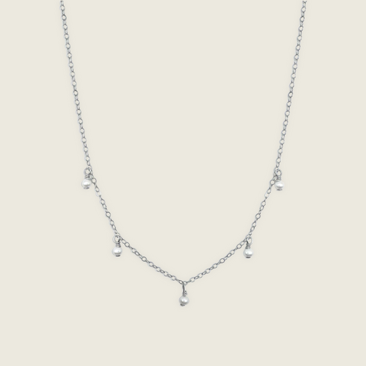 Timeless Pearl Necklace – handcrafted with genuine freshwater pearls and a Sterling Silver chain. A classic, elegant accessory perfect for any occasion. Shop now for a timeless jewelry piece!