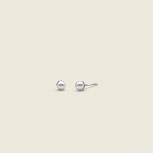 dainty pearl stud earrings in sterling silver with butterfly backings